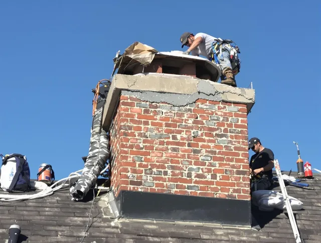 Tustin Chimney Sweep installing a custom chimney crown in Tustin, CA