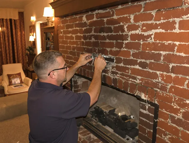 Tustin Chimney Sweep expert fixing a fireplace in Tustin, CA